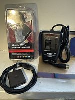 Overview showing fog machine timer, packaged DTECH USB extender, and 4K HDMI video switch with cable