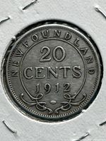 Reverse side of 1912 Newfoundland 20 cents coin showing denomination and date surrounded by 'Newfoundland' and decorative elements.