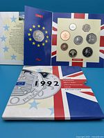 Front of unopened 1992 UK coin set package showing obverse side of coins and decorative Union Jack and Euro stars design.