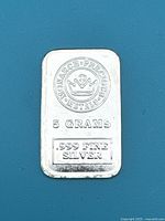Front side of 5 gram Monarch Precious Metals .999 Fine Silver Bar showing logo, weight, and purity