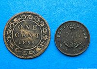 Both coins showing obverse sides: Canada 1859 penny with maple leaf border, Newfoundland 1947 one cent with sprig design
