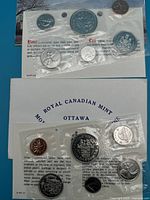 1971 and 1977 Canadian Coin sets sealed in original cellophane in envelopes with certificates from Royal Canadian Mint