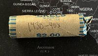 Photo of the coin roll wrapper labeled '1930-40's $2.00' from Harlan P. Morgan & Son, Inc.
