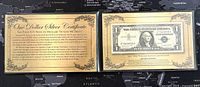 1957A US One Dollar Silver Certificate in a protective holder with the certificate of authenticity visible below the note.