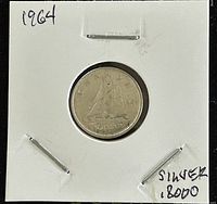 Reverse side of 1964 Canadian 10 cent silver coin showing sailing ship and denomination '10 CENTS'.