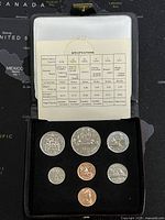 Black presentation case displaying seven 1978 Canadian coins with an informational specification card above them