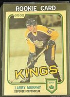 Front side of the 1981-82 O-Pee-Chee Larry Murphy rookie hockey card showing player image, team, and rookie designation.