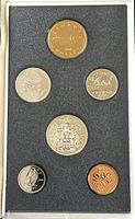 Front view of a 1990 Canadian specimen coin set with 6 different coins displayed in black foam case