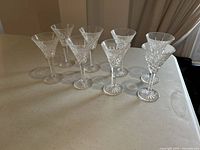 Eight Waterford Ashbourne liquor glasses standing in rows on a table showing full shape, stem, and base.
