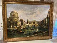 Full frontal view of the framed painting showing Venice canal and ornate frame