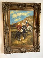 Full view of framed oil painting showing warriors on horses and ornate gilt frame