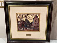 Full framed artwork showing winter street scene painting and label