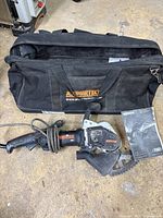 Top view showing saw, carry bag and manual