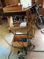 Ryobi router and Black & Decker Workmate folding workbench with various tools and clamps in garage space.