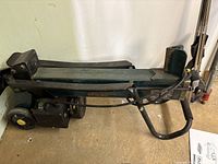 Full side view showing frame, wheels and motor housing