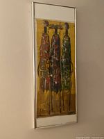 Framed full view showing the three stylized Maasai women figures with vivid color palette and metal frame.