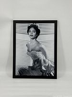 Front view of framed black and white photo of Dorothy Dandridge in elegant dress.