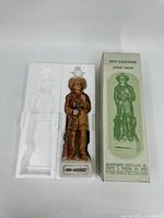 Full view of Kit Carson whiskey bottle with original box and styrofoam packaging.