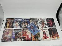 Full lot of 13 Elektra comics arranged showing covers