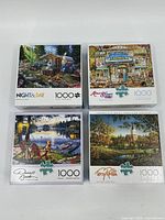 Four 1000-piece puzzle boxes with vibrant artwork featuring scenic and rustic themes.