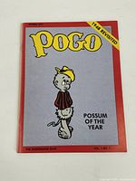 Front cover of the comic book with the title and cartoon possum character.