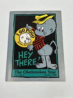 Front cover showing the character Pogo with yellow hat and red scarf on a dark background with text.