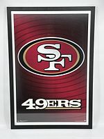 Front view of the framed San Francisco 49ers print showing logo and team name on a red gradient background.