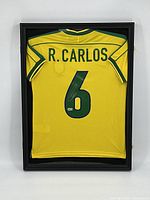 Full view of the framed yellow Brazil jersey showing back side with name and number