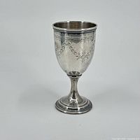 Front view of the chalice showing overall shape and engraved decoration