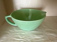 Jadeite green batter bowl showing front and handle side with spout