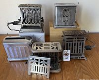 Group photo of all five vintage toasters labeled 1 to 5, showing varying conditions and designs.