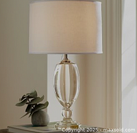 Styled photo of one Pottery Barn Lexington Crystal Table Lamp with a white drum shade on a table with minimal decor.