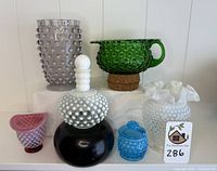 Group photo of six hobnail glass pieces showing variety in color and shape