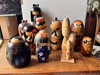 Overall assortment of kokeshi and Daruma dolls displayed on table