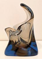 Front view of Murano art glass sculpture showing abstract shape and smoky grey to clear glass gradient.