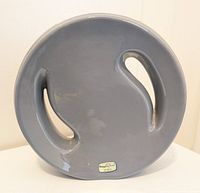 Bottom view of the vase showing original Haeger Pottery USA sticker label on the smooth gray ceramic base.