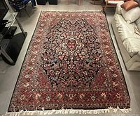 Full top-down view of rug in living room showing overall pattern and condition