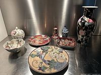 Full lot displayed on metal surface showing all seven pottery items