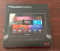Front view of the BlackBerry PlayBook box showing the tablet image and features with clear 16GB storage marking.