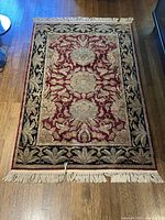 Full top view showing rug design, field and border