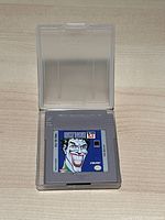 Front of the Nintendo Game Boy cartridge inside protective case showing Joker label