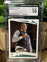 Front of the 2005-06 Topps Jay-Z card in CGC slab showing Gem Mint 10 grade with clear image of Jay-Z holding a microphone.