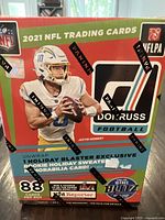 Front view of the sealed 2021 Donruss NFL Football Holiday Blaster box showing branding, player image, and promotional details