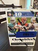 Front view of sealed blaster box showing 40 NFL trading cards, 8 packs with images of NFL players and Panini branding