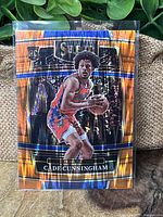 Front view of the Cade Cunningham 2021-22 Select Orange Wave rookie card showing player image and card design.