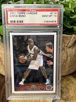 Front of 2003 Topps Chrome Chris Bosh rookie card in PSA 10 graded slab showing player image and card details