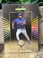 Front of the Joe Carter baseball card showing player in action with rainbow prism effect and gold accents