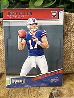 Front of Josh Allen 2018 Panini Playoff rookie card showing QB in blue Bills uniform.