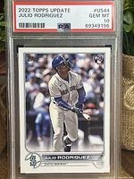 Front of the baseball card showing Julio Rodriguez in Mariners uniform with bat and PSA grading label at top with grade 10 Gem Mint.