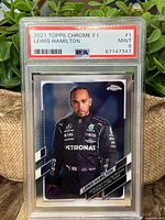 Front side of the 2021 Topps Chrome F1 Lewis Hamilton trading card graded Mint 9 by PSA in protective slab, showing player image and branding.